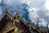 Fototapeta Dziecięca - The roof of the Thai temple, along with the gable at the top of the church with a sky backdrop