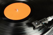 Vintage Vinyl Record With Empty Orange Label Played On Turntable With Audiophile Cartridge.