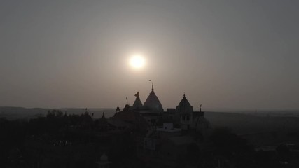 Wall Mural - Barsana temple sunset, India 4k aerial drone, ungraded/flat raw footage