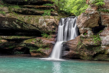 Sandstone Cascade in the Hocking Hills - Upper Falls at Old Man’s Cave is a beautiful waterfall that cascades over a sandstone cliff in Hocking Hills State Park, Ohio.