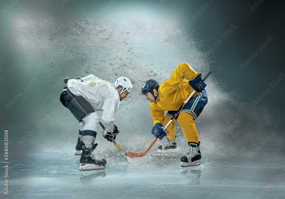 Caucassian ice hockey Players in dynamic action in a professiona - obrazy, fototapety, plakaty 