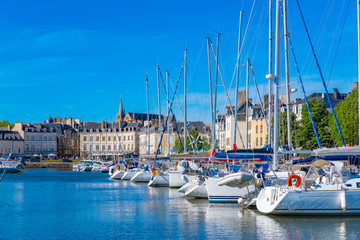 Wall Mural - Vannes harbor, in the Morbihan, Brittany, boats in the marina, with typical houses and the cathedral in background 