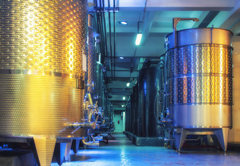 Equipment of contemporary winemaker factory..Wine Cellar And Production, Barrels For Wine storage Modern Development Technology Concept. Inside modern wine factory