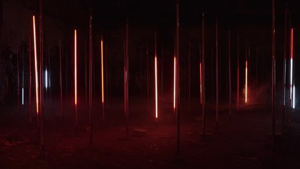 strange and creepy, colorful beaming lights glow in night darkness. sci-fi atmosphere of extraterres