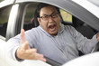 © airdone - Angry Asian Male Driver, Screaming Pointing From His Car