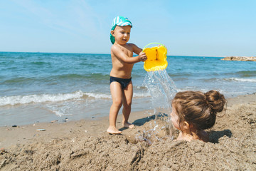 Wall Mural - brother dumping water water on sister