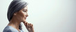 © Svyatoslav Lypynskyy - Pensive woman is touching chin and slightly smiles