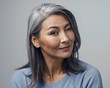 © Svyatoslav Lypynskyy - Charming Asian mature woman smiles at camera