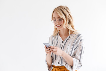 Poster - Photo of optimistic attractive woman wearing glasses smiling at phone and typing