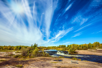 Wall Mural - Improbable plumose clouds and sun