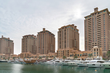 Wall Mural - Residential buildings and marina at the Pearl area in Doha, Qatar