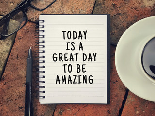 motivational and inspirational wording - today is a great day to be amazing written on a notebook.