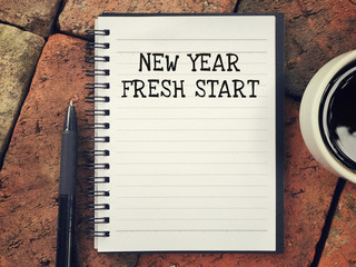 Wall Mural - New Year concept - New Year, Fresh Start written on a notebook.