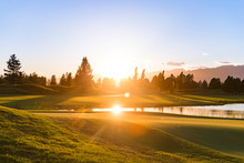 Sun Reflecting On Golf Course Lake