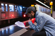 © Bonninstudio/Stocksy - Actor reading script in subway station.