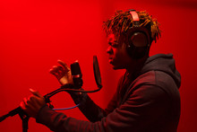 Side View Black Man Singing In Studio