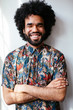 © Bonninstudio/Stocksy - Portrait of an afro man wearing flowered shirt.