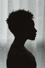 A Young African American Woman In Silhouette