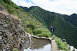 © Ivan Gener/Stocksy - Tourist traveler amazed by watching process of cultivating rice. Batad, Philippines.