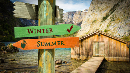 Wall Mural - Street Sign to Winter versus Summer