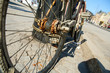 © shootingtheworld - A detail picture of the old unused abandoned bicycle left behind on the street. The chain is rusty and worn away.