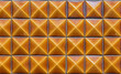 © Santi Nunez/Stocksy - Yellow tiles background on the wall, Porto. Portugal