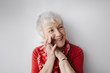 © Rob and Julia Campbell/Stocksy - Smiling senior woman