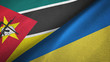 Mozambique and Ukraine two flags textile cloth, fabric texture