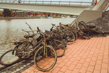 Porvoo, Finland - May 2019: Old Rusty Bicycles Abandoned On The River Bank In The Finnish City Of Porvoo. Bunch Of Rusty Bikes