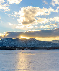 Wall Mural - Winter Sunset - A winter sunset view of frozen Bear Creek Lake. Denver-Lakewood, Colorado, USA.