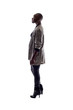 Black female African American model on a white background.  She is posed standing or waiting in side view.