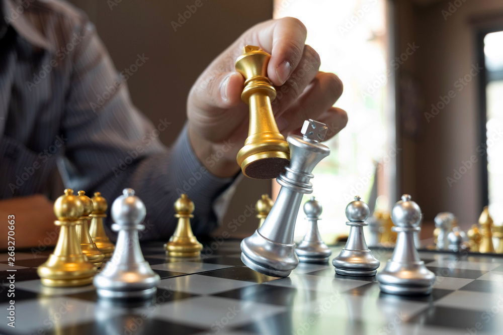 Close-up photos of checkmate hands on a chessboard during a chess game ...