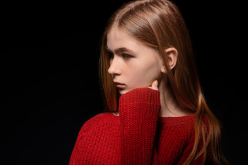 Wall Mural - Sad teenage girl on dark background