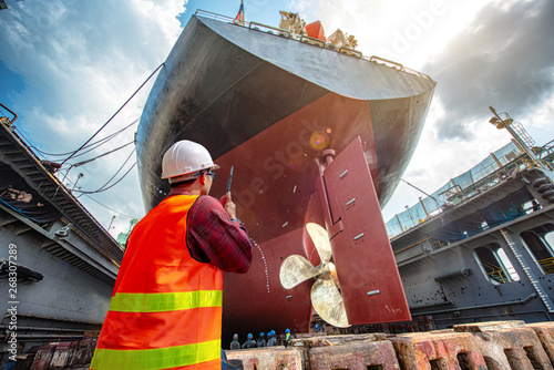 Fotomural port controller, harbor master in command on the terminal port for safety and co