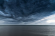 © Janis Smits - Dark clouds over Baltic sea.