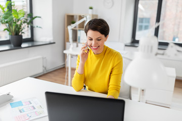 business, technology and ui design concept - smiling creative woman with laptop computer and user interface templates calling on smartphone at office