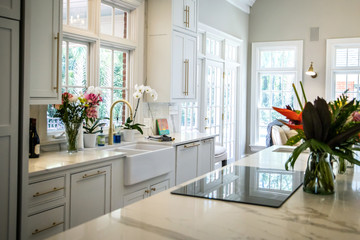 Wall Mural - Open Concept Elegant and Spacious Kitchen with Marble Countertops, Chandelier, and Two Toned Cabinets