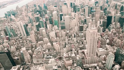 Wall Mural - NEW YORK CITY - DECEMBER 3, 2018: Aerial view of Empire State Building from helicopter in slow motion. This is a major city icon