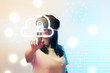© LIGHTFIELD STUDIOS - young woman in virtual reality headset pointing with finger at internet security illustration on beige and blue background
