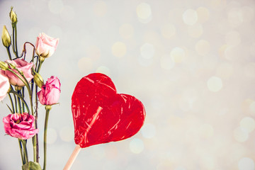 Canvas Print - Bouquet of lollipop red heart and small roses, copy space. Background about love, valentine's day