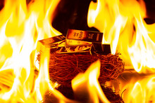 Gold Bars On Nest Surrounded By Big Fire Concept Of Investment Risk