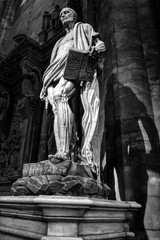 Close-up marble sculpture in Milan Cathedral (Duomo di Milano). Milan, Italy. May 2012