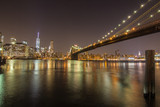 Fototapeta  - New york skyline during night from river