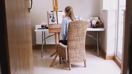 Wall Mural - View Through Door Of Female Teenage Artist At Easel Drawing Picture Of Dog In Charcoal