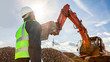 Leinwandbild Motiv construction worker or engineer on construction site with excavator 