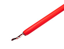 Big Red Ink Drop On Pointed Nib Of Dip Pen