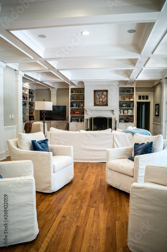 Large Living Room Den In Home With Vaulted Tray Ceiling And