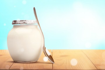 Sticker - Healthy fresh  yogurt with spoon on background