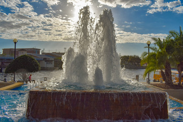 Wall Mural - Tampa Bay, Florida. March 02, 2019. Fountain on sunset sky background at Straz Center in downtown area