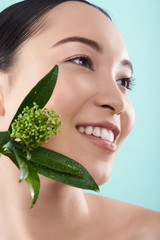 Sticker - Portrait of happy Asian lady posing with branch of plant